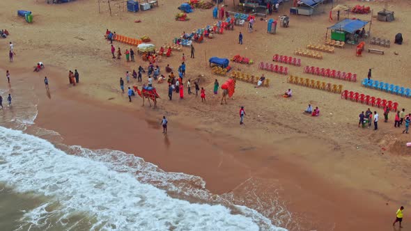 Aerial view of a crowded beach in India, Puri, Orissa. 4k