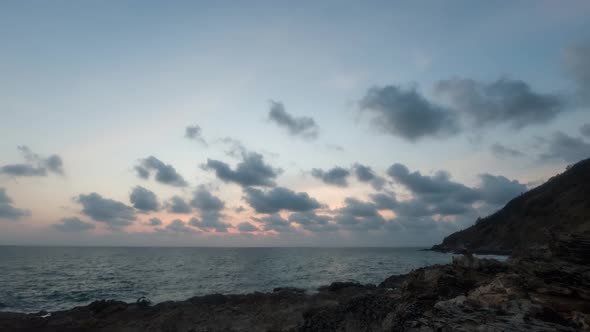 A landscape shot of a dramatic sunset in Thailand, dark clouds start to slighly cover the sky while