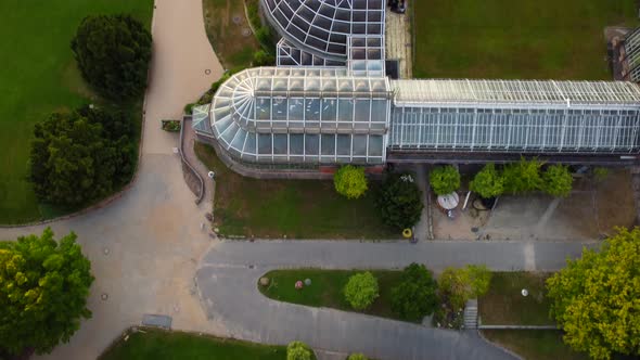 Side view of the futuristic steel glass dome constructiUnbelievable above aerial view flight tilt u