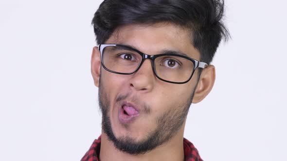 Young Happy Bearded Indian Hipster Man Making Funny Faces