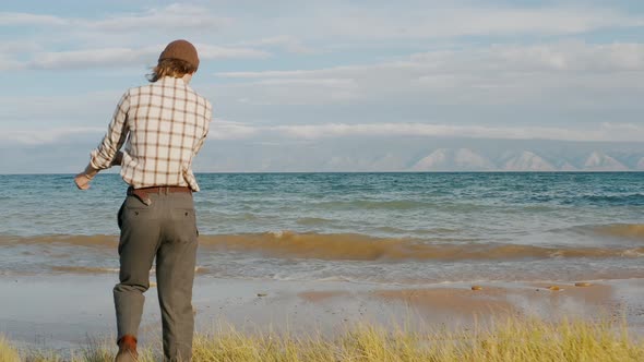 Man is resting by the lake Summer Baikal lake Olkhon island