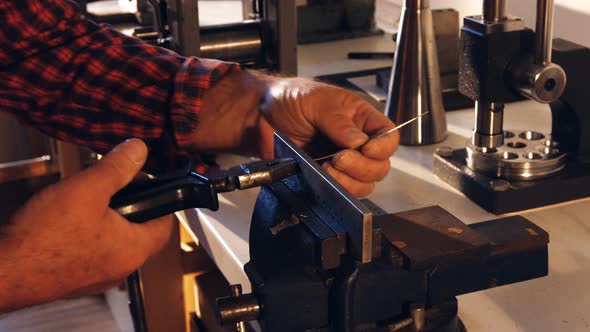 Goldsmith working in workshop