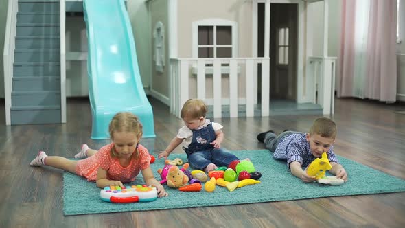 Group of Children Playing on the Carpet