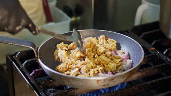 Slow motion of shawarma cooking in a frying pan