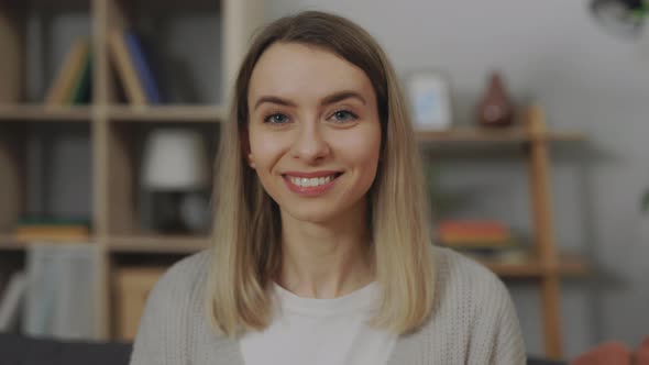 Portrait of Smiling Caucasian Lady Sitting in Living Room