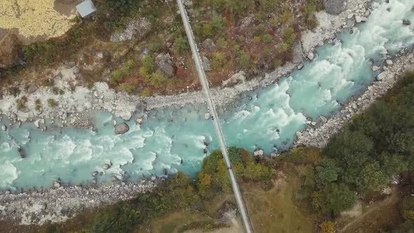 Mountain River And Bridge. Nepal. Aerial Footage