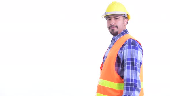 Profile View of Happy Bearded Persian Man Construction Worker Smiling with Arms Crossed