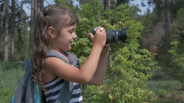 A child takes pictures with a camera