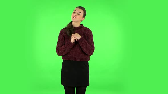 Lovely Girl Daydreaming and Smiling Looking Up. Green Screen