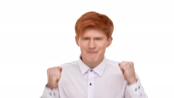 Ginger Caucasian Attractive Young Man Rejoicing Looking at Camera on White Background