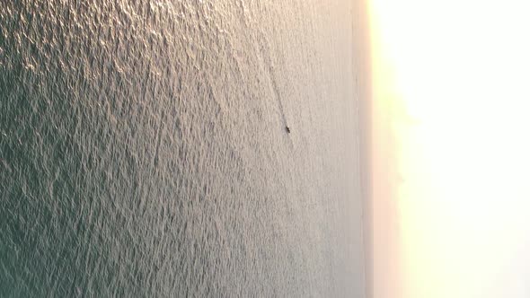 Vertical Video of the Ocean Near the Coast of Zanzibar Tanzania Aerial View