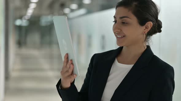 Portrait of Young Indian Businesswoman Doing Video Call on Digital Tablet