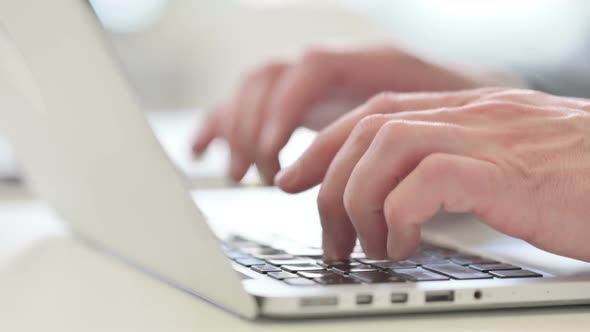 Close Up of Businessman Typing on Laptop