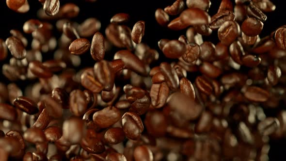 Super Slow Motion Shot of Exploding Premium Coffee Beans Towards the Camera at 1000Fps