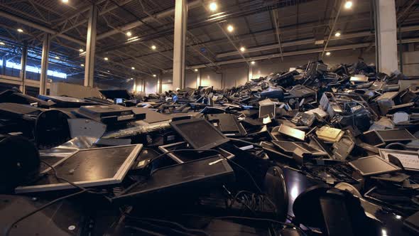 Discarded Screens in a Pile in a Recycling Facility.