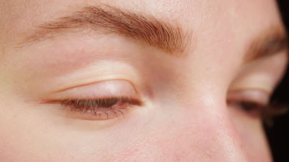 Closeup of a Green Eyes Blinking Opening and Closing