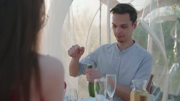 Young Couple Celebrates Anniversary with Champagne