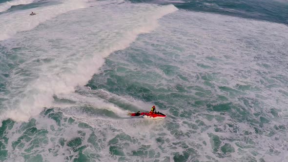 Aerial view of lifeguard surf rescue jet ski personal watercraft in Hawaii.