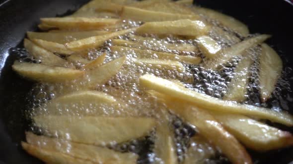Potato Boiling Fried in Hot Oil in Pan