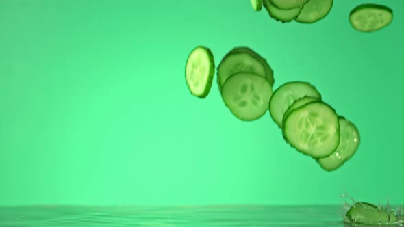 Super Slow Motion Cucumber Pieces Fall on the Water