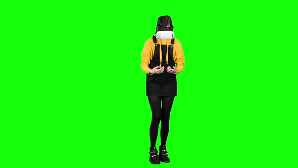 Teen Looks Into Vr. Green Screen