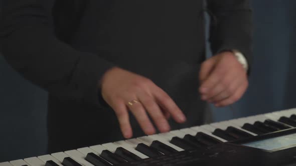 Closeup Keyboardist Hands with Wedding Ring.