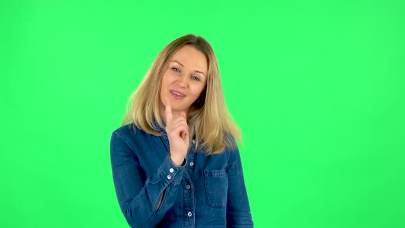 Portrait of Fair Woman Is Seductively Smiling and Gesture Threatens By Shaking Her Index Finger