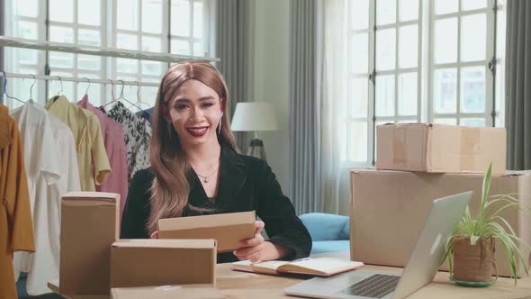 Asian Transgender Woman Business Owner With Boxes, Pose And Smiles To Camera