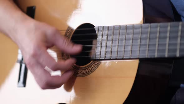 A man plays rock and jazz-folk guitar. close up. HD