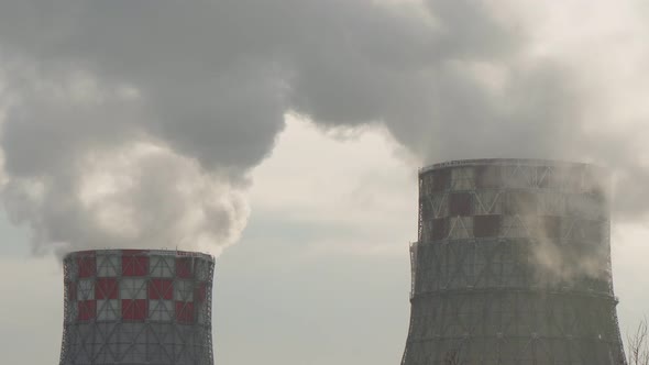 Industrial Zone with Pipe Thick White Smoke is Poured From the Factory Chimney