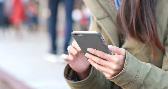 Woman use of mobile phone at outdoor