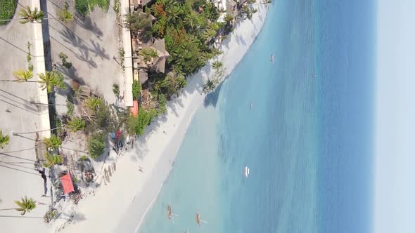 Vertical Video Boats in the Ocean Near the Coast of Zanzibar Tanzania Aerial View