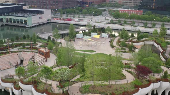 An aerial view of Manhattan's Little Island, a public green space, taken early in the day. The camer