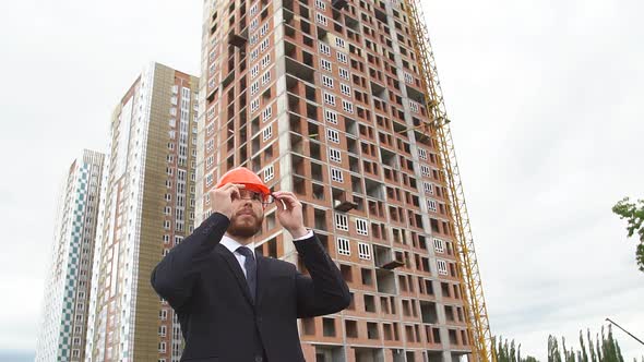 Portrait of Male Architect . Young People at Construction Site