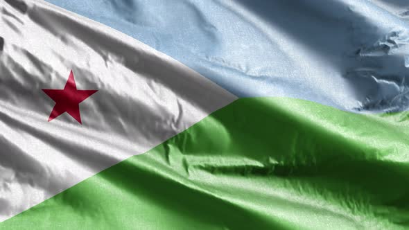Djibouti textile flag waving on the wind. Slow motion. 20 seconds loop.