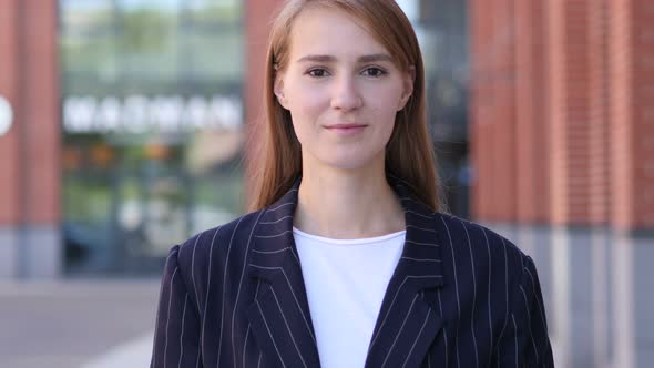 Portrait of Serious Businesswoman Looking at Camera