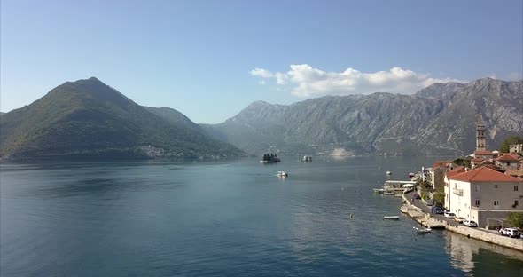 Bay of Kotor in Montenegro. Perast, coastal town on the right, man made islands in the centre and mo