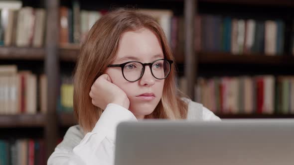 Emotional Young Girl Looking at Laptop Screen Reading Email with Unexpected Amazing News Celebrating