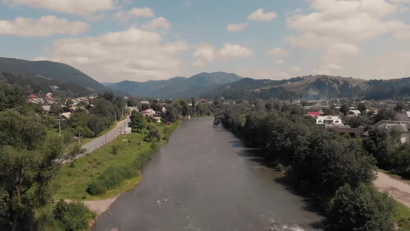 Countryside Landscape with River and Mountains