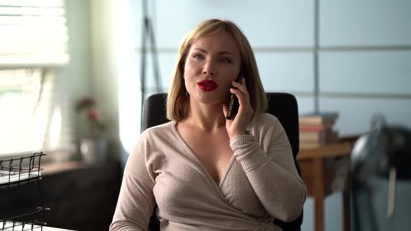 Smiling Businesswoman Professional Talking on the Phone Sit on the Home Office Desk, Happy Female