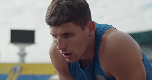 Athlete Taking Break on Cloudy Day