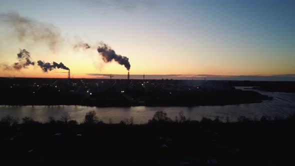  Smoking Stack in Sunrise. Air Pollution and Climate Change Theme. Poor Environment in the City