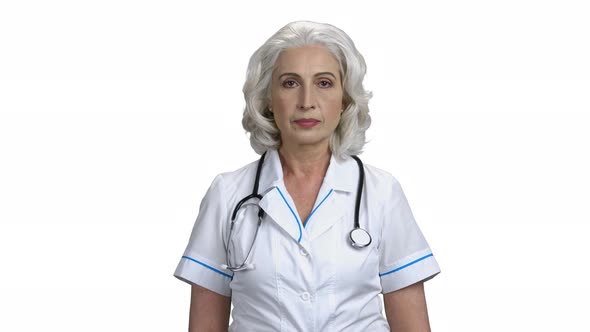 Portrait of Smiling Female Doctor on White Background alt