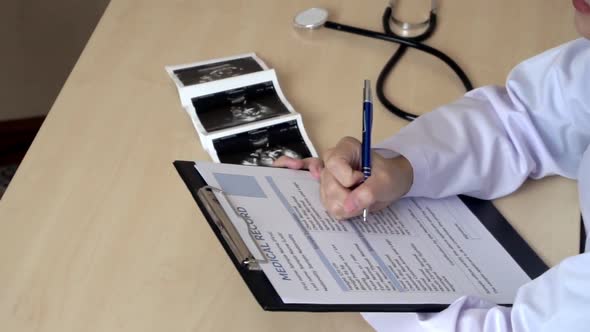 Pregnant Woman and Gynecologist Doctor at Hospital