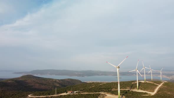 Drone Flies Over a Windmill Park