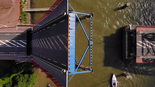 Single-leaf Bascule Bridge Opening Over River Noord With Sailboats Passing By In Alblasserdam, Nethe