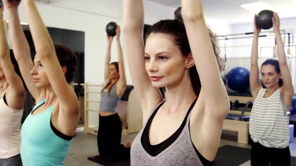 Beautiful women exercising in fitness studio