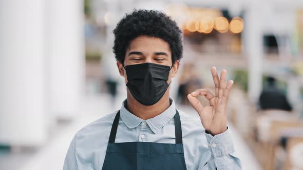 Masked African American Male Cafe Worker Waiter Salesman in Apron Medical Face Mask Successful Man