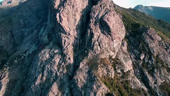 rocky mountain peaks with clear blue skies. flight over a National Park Los Bellotos.  green vegetat