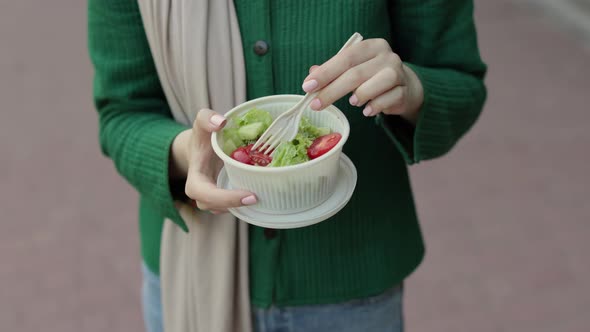 Close Up View of Hand of Woman Having a Vegetables Salad for Lunch